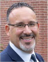 Dr. Miguel A. Cardona